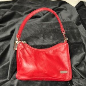 Red Leather Shoulder Bag by Wilson’s leather. Deep color of red.